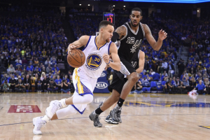 January 25, 2016; Oakland, CA, USA; Golden State Warriors guard Stephen Curry (30) dribbles the basketball against San Antonio Spurs forward LaMarcus Aldridge (12) during the first quarter at Oracle Arena.  <br/>Kyle Terada-USA TODAY Sports