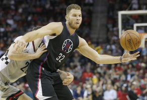 Dec 19, 2015; Houston, TX, USA; Los Angeles Clippers forward Blake Griffin (32) is defended by Houston Rockets forward Donatas Motiejunas (20) in the second half at Toyota Center. Rockets won 107 to 97.  <br/>Thomas B. Shea-USA TODAY Sports