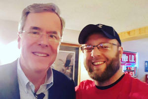 Republican presidential candidate Jeb Bush poses with Justin Scott after a recent town hall meeting in Iowa.  <br/>Facebook