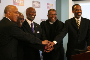 Senior bishops and representatives of the African Methodist Episcopal Church Zion Church, the African Methodist Episcopal Church and the Christian Methodist Episcopal Church join hands at the announcement of their new collaboration. The three denominations will host a historic gathering March 1-3 in Columbia, S.C. <br/>The Christian Post