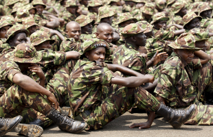 Members of the Kenya Defence Forces attend prayers as they pay their respects to the Kenyan soldiers serving in the African Union Mission in Somalia (AMISOM), who were killed in El Adde during an attack, at a memorial mass at the Moi Barracks in Eldoret, January 27, 2016. <br/> REUTERS/Thomas Mukoya