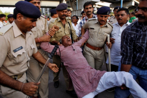 A member of India's lowest caste ''Dalits'' shouts slogans as he is detained by police during a demonstration in the western Indian city of Ahmedabad, April 27, 2014. Dalit Christians in India are planning a rally for March regarding discriminations against their Christian faith. Reuters  <br/>Reuters 
