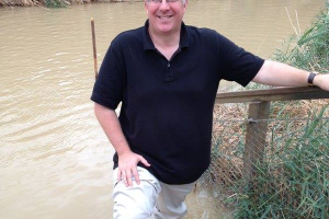 Standing in the Jordan River, the latest stop in The Joshua Fund’s 2015 Prayer and Vision Tour, is best-selling Christian author Joel Rosenberg. He recently shared concerns about how the presidential candidates of either political party would handle ISIS and says there’s no way to stop apocalyptic Islam without destroying the entire movement.<br />
 <br/>Facebook 