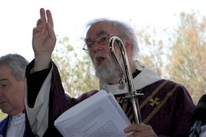 Archbishop of Canterbury, Rowan Williams gives a blessing during his visit to the baptismal site on the Jordan River, west of Amman, Jordan, Saturday, Feb. 20, 2010. Williams lay the foundation stone for the Anglican Church of St. John the Baptist at the site, to be built on land donated by Jordan's King Abdullah. <br/>AP Photo / Nader Daoud
