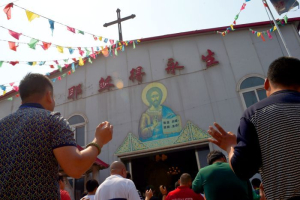 Chinese celebrating at an ''underground'' church in Tianjin, a province thought to have up to 100,000 Catholics. AFP<br />
 <br/>AFP