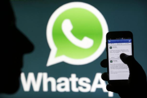 A Whatsapp App logo is seen behind a Samsung Galaxy S4 phone that is logged on to Facebook in the central Bosnian town of Zenica, February 20, 2014. Reuters <br/>