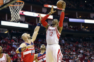 Jan 30, 2016; Houston, TX, USA; Houston Rockets center Dwight Howard (12) shoots the ball as Washington Wizards center Marcin Gortat (13) defends during the first quarter at Toyota Center.  <br/>Troy Taormina-USA TODAY Sports