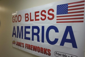 After a God Bless America sign was taken down during late January in a Pittsburg, Kan., post office after a complaint and lawsuit filed by Freedom From Religion Foundation, a local business owner from Jake's Fireworks printed and gave away 1,200 new God Bless banners -- one of which now hangs in the office Sen. Jerry Moran, R-Kan. (shown here).  <br/>@Jerry Moran