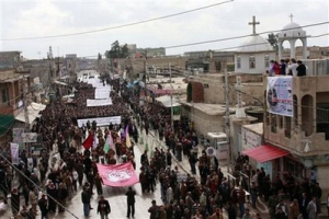 Protesters gather at a demonstration against recent attacks on Christians near Mosul, 360 kilometers (225 miles) northwest of Baghdad, Iraq, Sunday, Feb. 28, 2010. <br/>AP Images / Gregorio Borgia