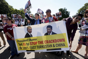 Tibetan, Chinese, Uygur and American activists rally outside the White House in Washington. <br/>Reuters