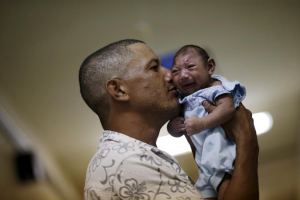 Geovane Silva holds his son Gustavo Henrique, who has microcephaly, at the Oswaldo Cruz Hospital in Recife, Brazil, January 26, 2016. (Image credit: REUTERS/Ueslei Marcelino) <br/>REUTERS/Ueslei Marcelino