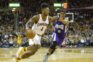 Feb 8, 2016; Cleveland, OH, USA; Cleveland Cavaliers guard Iman Shumpert (4) drives against Sacramento Kings guard Rajon Rondo (9) in the fourth quarter at Quicken Loans Arena.  <br/>David Richard-USA TODAY Sports