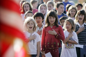 Fairmeadow Elementary School students recite the Pledge of Allegiance during a school assembly in Palo Alto, Calif., Monday, Nov. 5, 2007. <br/>AP Images / Paul Sakuma