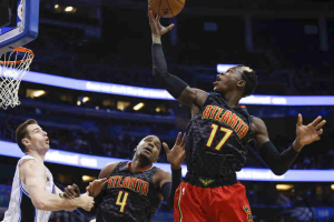 Feb 7, 2016; Orlando, FL, USA; Atlanta Hawks forward Paul Millsap (4) holds back Orlando Magic guard Mario Hezonja (23) as Hawks guard Dennis Schroder (17) grabs the rebound during the second quarter during the first quarter of a basketball game at Amway Center.  <br/>Reinhold Matay-USA TODAY Sports