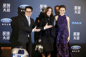 Director JJ Abrams (L) and producer Kathleen Kennedy (C) and cast member Daisy Ridley arrive at the China premiere of the film 