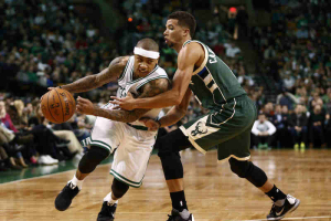 Boston, MA, USA; Boston Celtics guard Isaiah Thomas (left) drives to the hoop against Milwaukee Bucks guard Michael Carter-Williams (right) during the second half at TD Garden.  <br/>Mark L. Baer-USA TODAY Sports