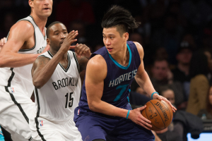 Feb 21, 2016; Brooklyn, NY, USA; Charlotte Hornets guard Jeremy Lin (7) dribbles around Brooklyn Nets guard Donald Sloan (15) in the second half at Barclays Center.The Hornets defeated the Nets 104-96. Mandatory Credit: William Hauser-USA TODAY Sports <br/>