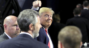 Jerry Falwell Jr.’s endorsement of GOP presidential candidate Donald Trump draws objections from his late father’s confidant, David DeMoss, who sits on the Liberty University board. Picture shows Trump pointing at Falwell at Liberty University on Tuesday, Jan. 26, 2016, just days before Iowa caucuses. Reuters <br/>