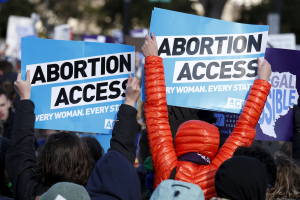 Protesters demonstrate in front of the U.S. Supreme Court in the morning as the court takes up a major abortion case focusing on whether a Texas law that imposes strict regulations on abortion doctors and clinic buildings interferes with the constitutional right of a woman to end her pregnancy, in Washington March 2, 2016.  <br/>REUTERS/Kevin Lamarque