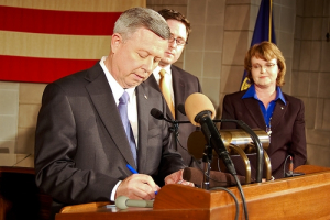 Gov. Dave Heineman (left) is joined by Sen. Mike Flood (not pictured), Sen. Cap Dierks (not pictured), Dave Bydalek of Nebraska Family First (second from right) and Julie Schmit-Albin of Nebraska Right to Life (far right) during the signing two pro-life bills - LB 1103 and LB 594 - on Tuesday, April 13, 2010. <br/>State of Nebraska