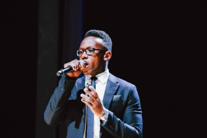 The Voice new singing contestant, Brian Nhira, was asked to sing ''Jesus Loves Me'' by Pharrell Williams after he was chosen by two coaches on Monday's blind auditions. <br/>Facebook Brian Nhira