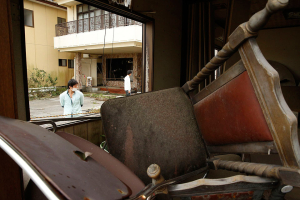 Seven miles from the Fukushima Daiichi nuclear power plant, buildings and cars destroyed by the March 11, 2011, tsunami still stand in the neighborhood near the former Tomioka train station. <br/>