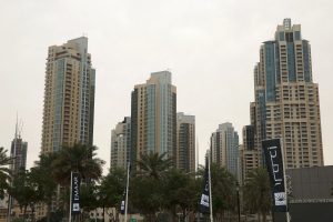 Flags for property company EMAAR are seen in front of buildings in Dubai, UAE March 7, 2016.  <br/>REUTERS/Ahmed Jadallah