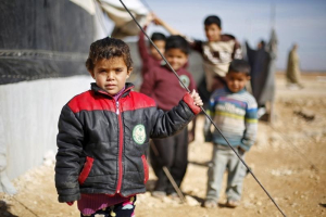 Syrian refugee children pose as they play near their families' residence at Al Zaatari refugee camp in the Jordanian city of Mafraq, near the border with Syria, January 30, 2016. Photo Credit: REUTERS/ Muhammad Hamed <br/>