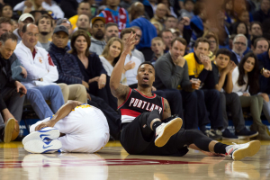 Mar 11, 2016; Oakland, CA, USA; Portland Trail Blazers guard Damian Lillard (0) reacts after being called for a foul against Golden State Warriors forward Andre Iguodala (9) during the third quarter at Oracle Arena. The Golden State Warriors defeated the Portland Trail Blazers 128-112.  <br/>Kelley L Cox-USA TODAY Sports