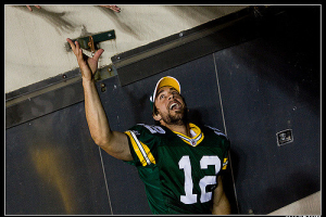Green Bay Packers starting quarterback Aaron Rodgers runs off Lambeau Field into the tunnel amid a standing ovation. <br/>Relux/Flickr CC