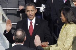 Barack Obama, left, joined by his wife Michelle, takes the oath of office from Chief Justice John Roberts to become the 44th president of the United States at the U.S. Capitol in Washington, Tuesday, Jan. 20, 2009. <br/>AP Images / Jae C. Hong