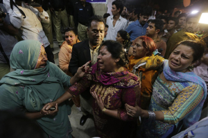 Distressed relatives of blast victims gather outside a hospital in Lahore, Pakistan, Monday, 2016. EPA <br/>
