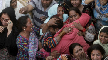 The death toll from a massive suicide bombing targeting Christians gathered on Easter in the eastern Pakistani city of Lahore rose as the country started observing a three-day mourning period following the attack. Photo Credit: Reuters <br/>