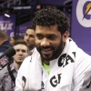 Russell Wilson answers media questions at Super Bowl XLIX media day 