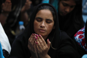 A Pakistani Christian woman prays during a Good Friday service at Saint Anthony Church in Lahore March 29, 2013. Photo Credit: Reuters <br/>