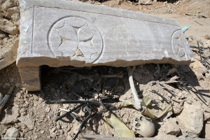 Under the broken stone cover of a sarcophagus lay the skull and bones of Saint Elian. Photo Credit: AP Photo <br/>