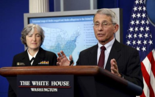 Dr. Anthony Fauci (right), director of the National Institute for Allergy and Infectious Disease, and Dr. Anne Schuchat, Center for Disease Control's principal deputy director appeared before White House reporters April 11, 206, to press their case for Congress to approve $1.9 billion in emergency funding to fight the virus. <br/>Reuters / Kevin Lamarque 