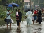 sri-lankans-wade-through-submerged-road.jpg