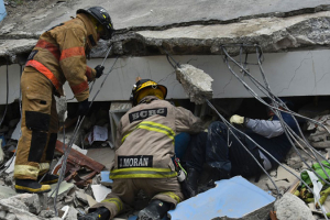 Rescue workers search the rubble of a collapsed building for victims in Guayaquil, Ecuador, on April 17. (Luis Acosta/AFP/Getty Images) <br/>