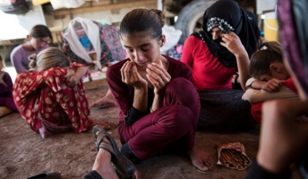 The Islamic State terrorist group executed a pregnant woman and took away her four children after they tried to flee their village in Iraq, a horrific new report has revealed. Over the past two years, thousands of Yazidi and Christian women in the Middle East have experienced extreme brutality at the hands of Islamic State militants, prompting US Secretary of State John Kerry to class such atrocities as ''genocide.'' Photo Credit: Reuters <br/>