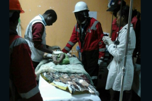 A baby girl receives treatment after being rescued from the rubble of a building in Nairobi. <br/>