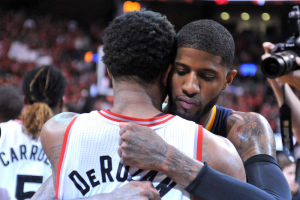 May 1, 2016; Toronto, Ontario, CAN; Indiana Pacers forward Paul George (13) embraces Toronto Raptors guard DeMar DeRozan (10) after the Raptors 89-84 win in game seven of the first round of the 2016 NBA Playoffs at Air Canada Centre.  <br/>Dan Hamilton-USA TODAY Sports