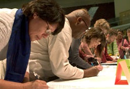 Members of the newly formed World Communion of Reformed Churches sign the constitution and bylaws of the new organization, Jun 18, 2010. <br/>WCRC / Erick Coll