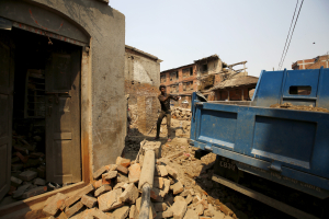 A man works to rebuild a house a year after the 2015 earthquakes in Bhaktapur, Nepal, April 25, 2016. REUTERS/Navesh Chitrakar <br/>