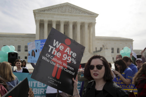 Supporters of contraception rally before Zubik v. Burwell, an appeal brought by Christian groups demanding full exemption from the requirement to provide insurance covering contraception under the Affordable Care Act, is heard by the U.S. Supreme Court in Washington, U.S., March 23, 2016. REUTERS/Joshua Roberts/File Photo <br/>