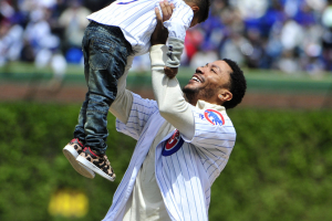 Chicago, IL, USA; Chicago Bulls guard Derrick Rose lifts up his son DJ after throwing out the ceremonial first pitch before the game between the Chicago Cubs and the Pittsburgh Pirates at Wrigley Field.  <br/>David Banks-USA TODAY Sports