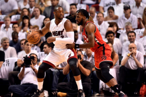 May 13, 2016; Miami, FL, USA; Miami Heat guard Dwyane Wade (3) dribbles the ball as Toronto Raptors forward DeMarre Carroll (5) defends during the first quarter in game six of the second round of the NBA Playoffs at American Airlines Arena.  <br/>Steve Mitchell-USA TODAY Sports