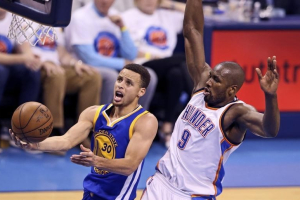 Oklahoma City, OK, USA; Golden State Warriors guard Stephen Curry (30) shoots past Oklahoma City Thunder forward Serge Ibaka (9) during the second quarter in game four of the Western conference finals of the NBA Playoffs at Chesapeake Energy Arena.  <br/>Kevin Jairaj-USA TODAY Sports