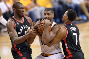 May 25, 2016; Cleveland, OH, USA; Toronto Raptors center Bismack Biyombo (8) and guard Kyle Lowry (7) battle with Cleveland Cavaliers center Tristan Thompson (13) for a loose ball during the second half in game five of the Eastern conference finals of the NBA Playoffs at Quicken Loans Arena. The Cavs won 116-78.  <br/>Ken Blaze-USA TODAY Sports