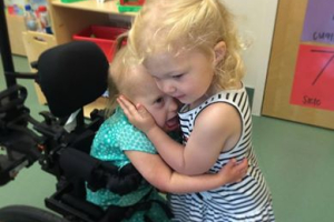 Indy Feek, 2, tries out her new wheelchair.  <br/>Facebook/Rory Feek